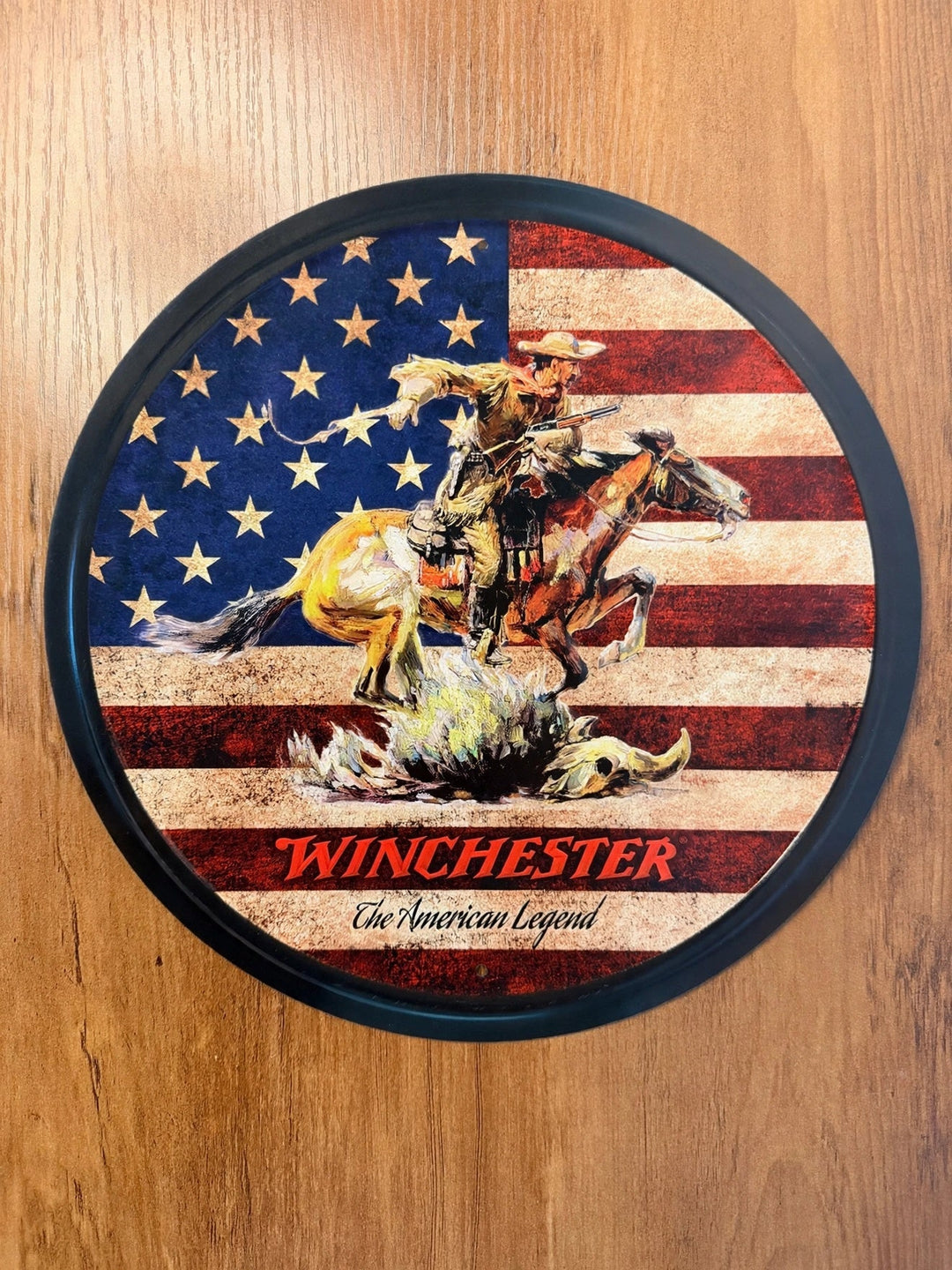 Winchester The American Legend round tin sign with cowboy and US flag