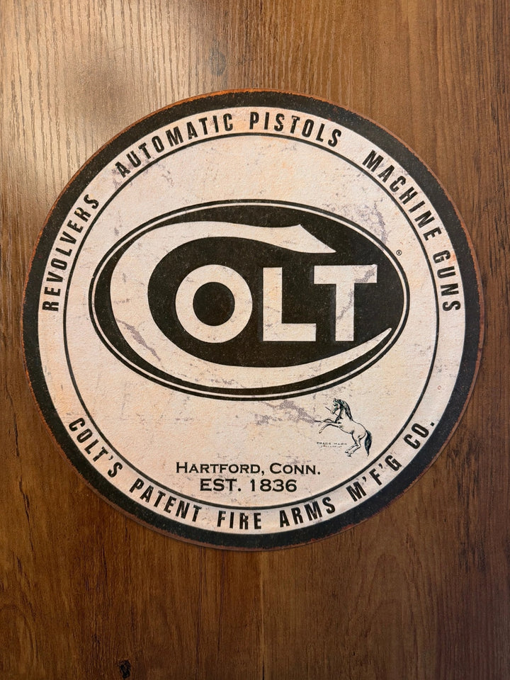 Colt firearms round black and white tin sign